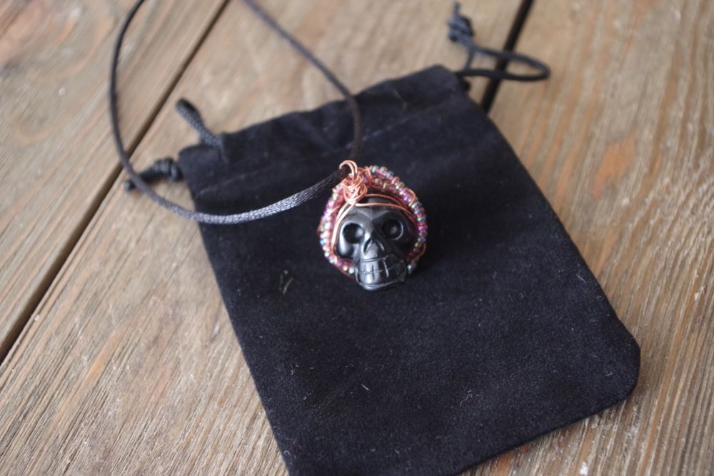 Obsidian skull carving with beads pendant